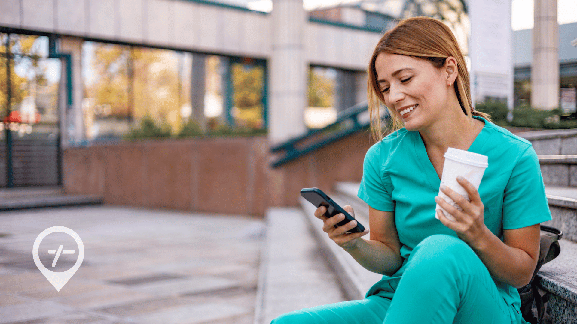 A nurse is sitting outside of a healthcare facility and looking at open shifts on her phone.