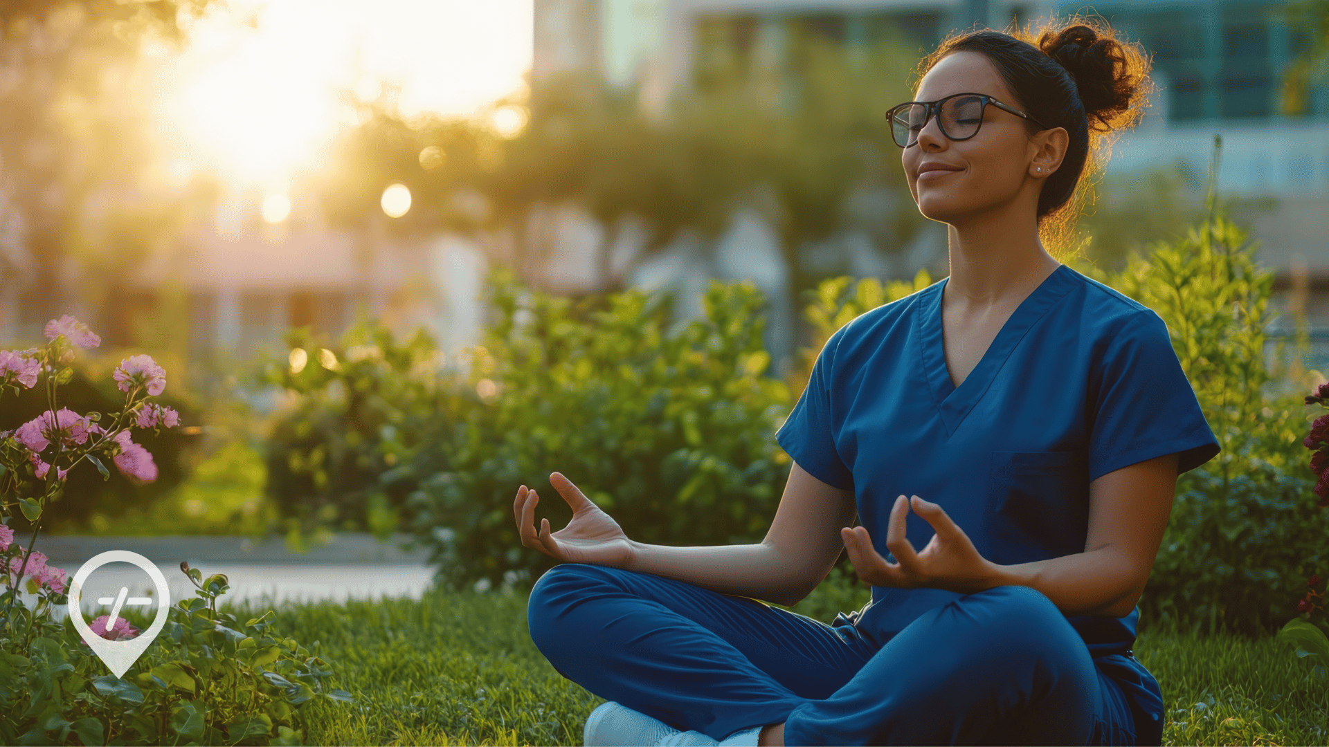 A nurse sits in a hospital garden practicing mindfulness techniques to reduce stress.