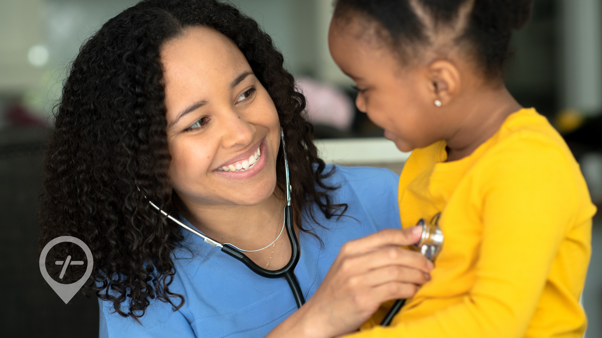 A nurse is smiling as she checks a little girl's heartbeat. 