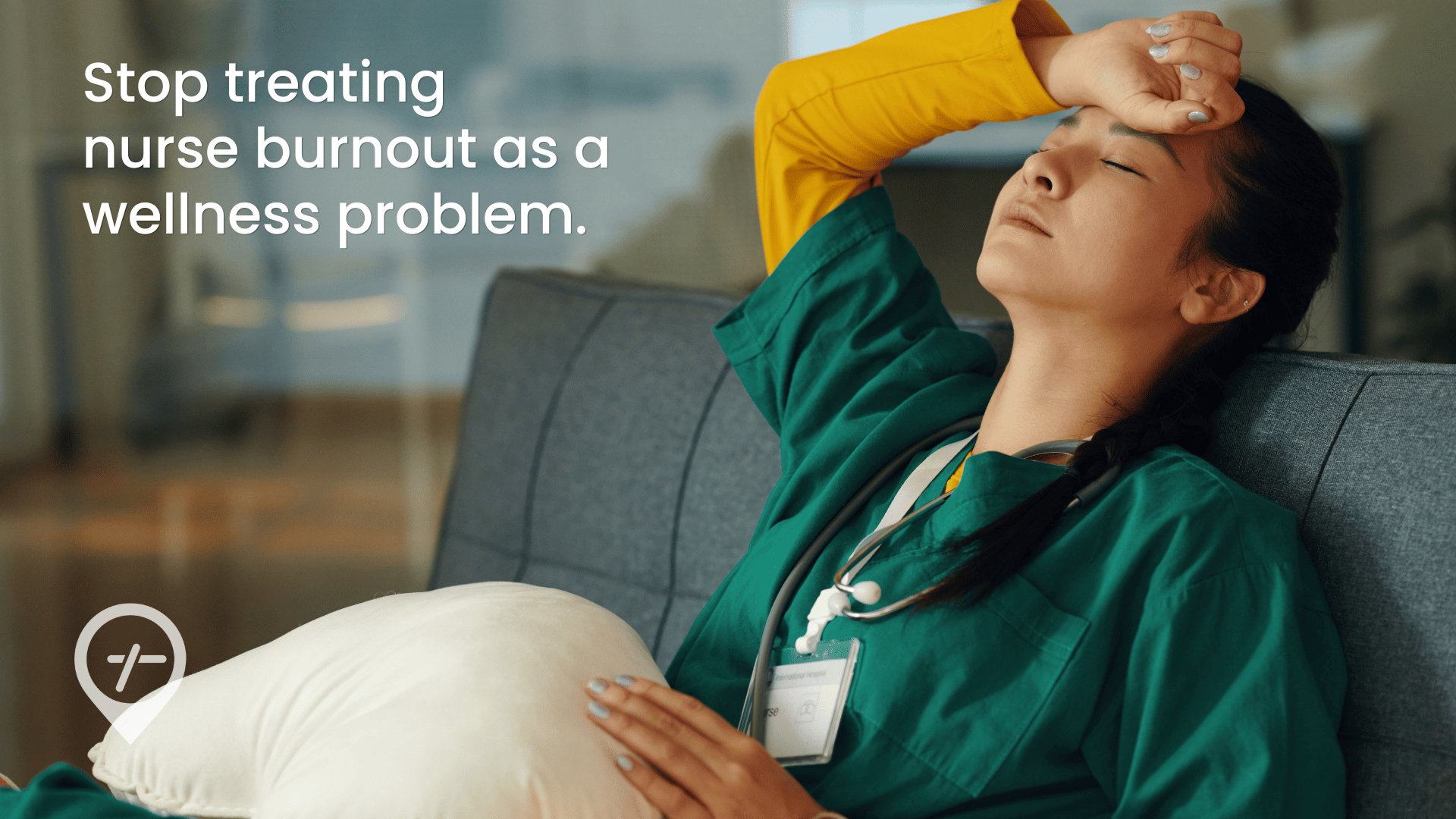 Nurse sitting on a couch looking stressed and exhausted after a shift, reflecting burnout, fatigue, and emotional strain in healthcare workforce conditions.