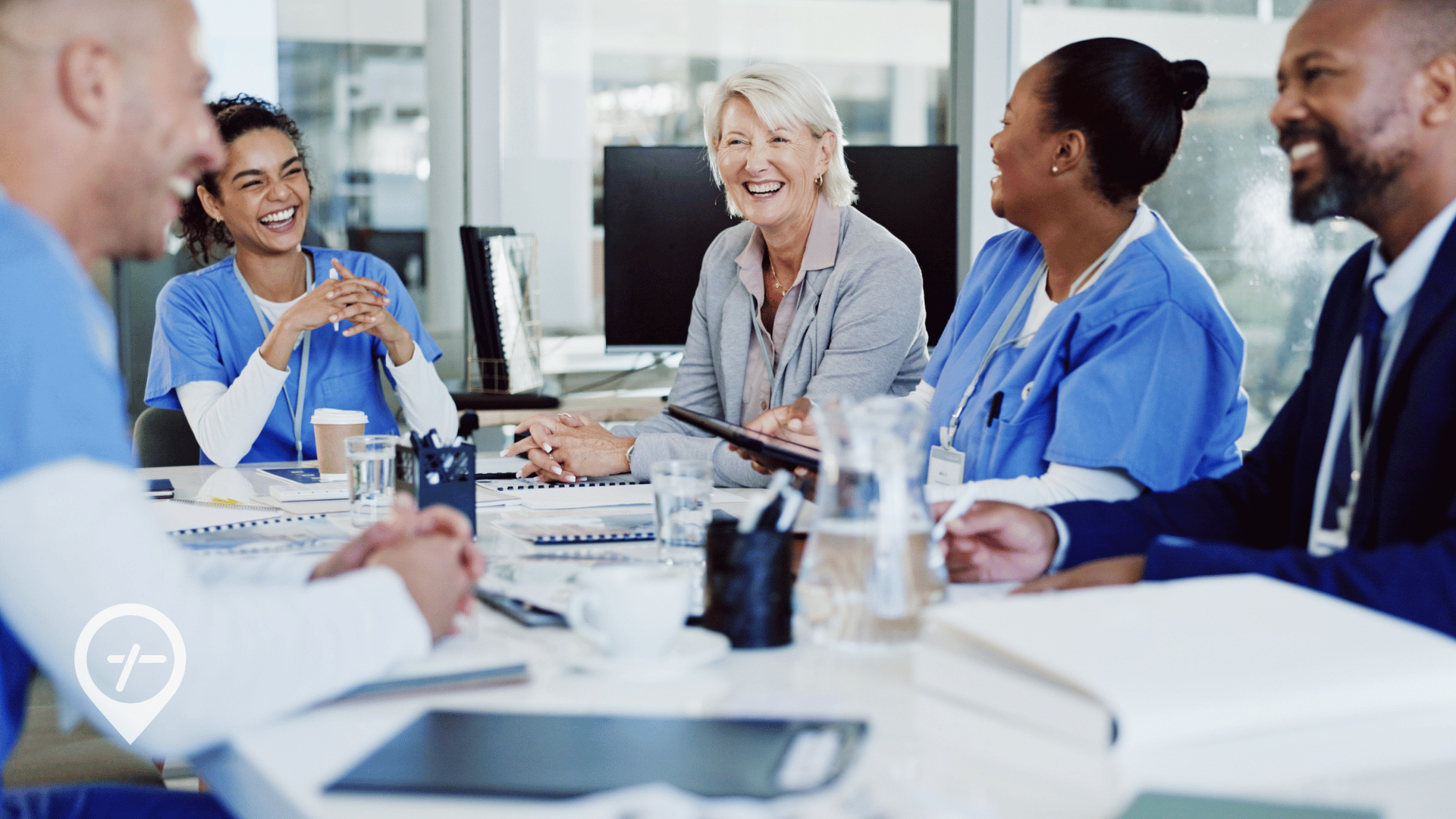 Hospital CNO and COO meeting with nurse leaders to review workforce strategies for improving margins during seasonal surges.