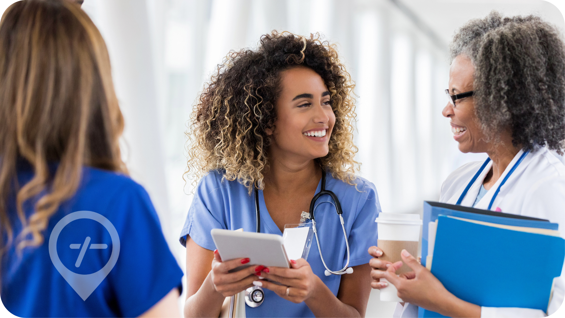 Female nurse smiles at nurse supervisor