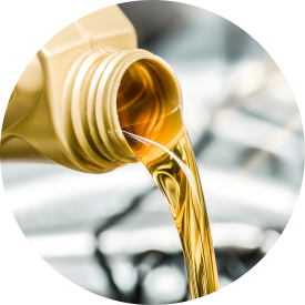  Oil being poured from a container into a vehicle engine.