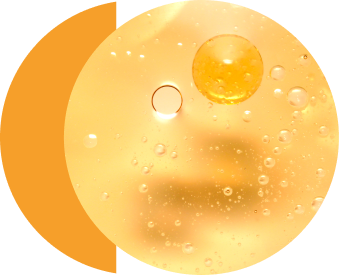 Bubbles floating in clear yellow liquid.