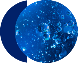 Bubbles floating in clear blue liquid.