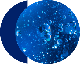 Bubbles floating in clear blue liquid.