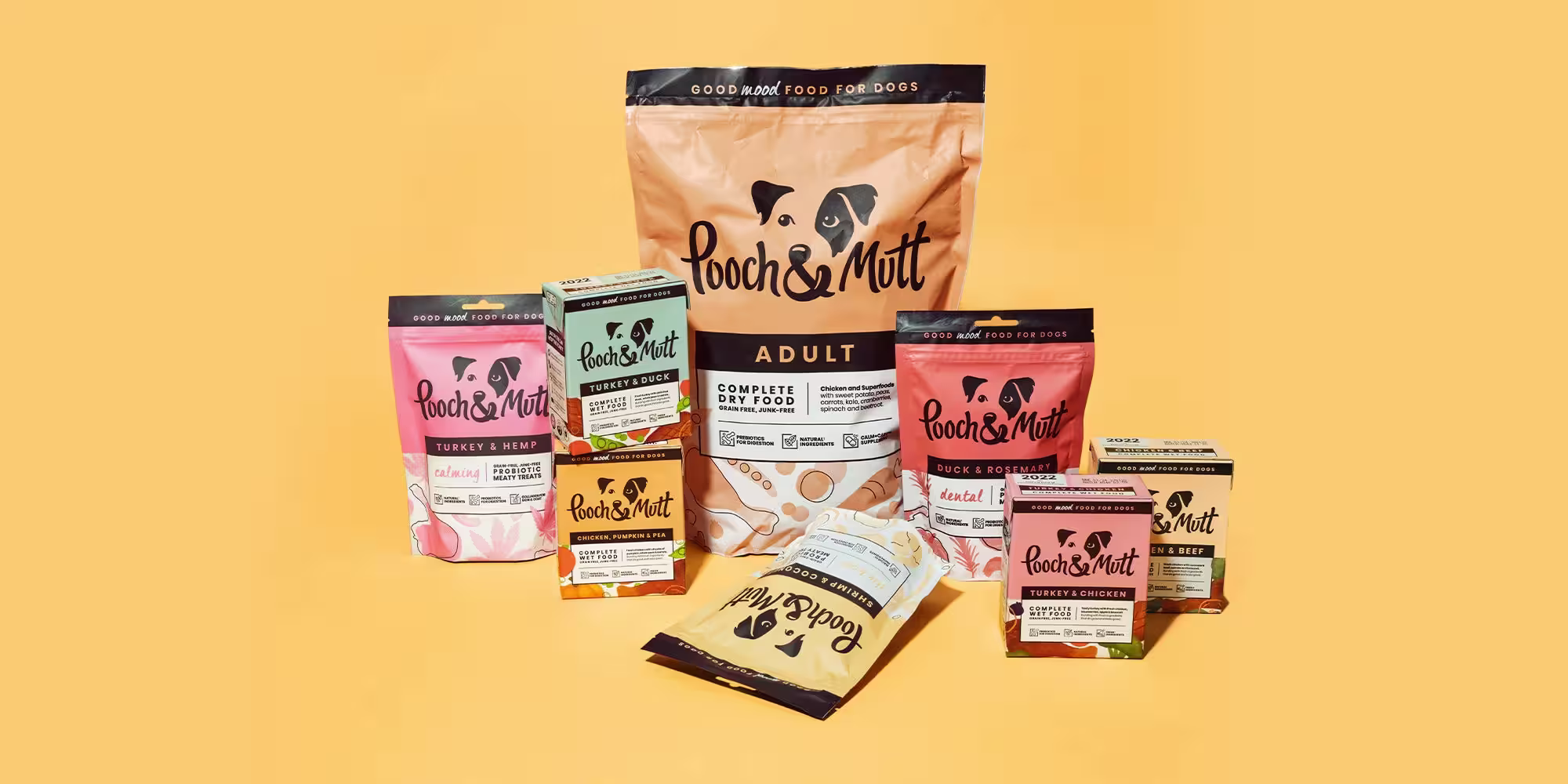 A range of Pooch & Mutt grain-free products on a pale orange background