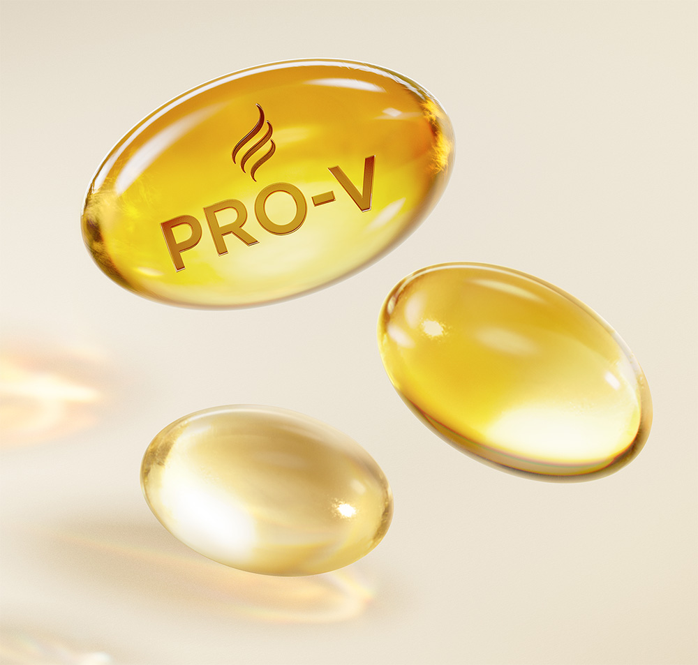 Cápsula dorada "PRO-V" sobre fondo blanco brillante.