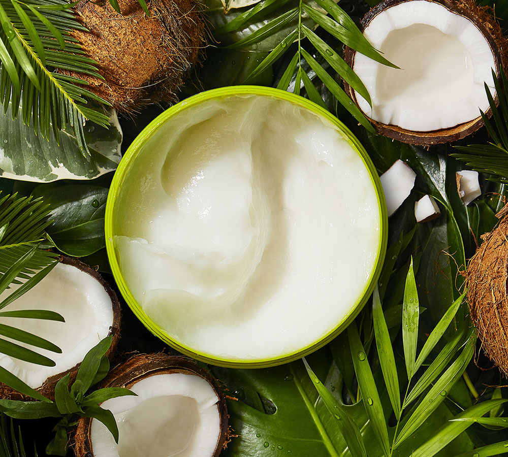 Mascarilla Herbal Essences Coco, con hojas verdes y cocos partidos