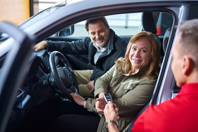 Happy customers who get their car back after repairs