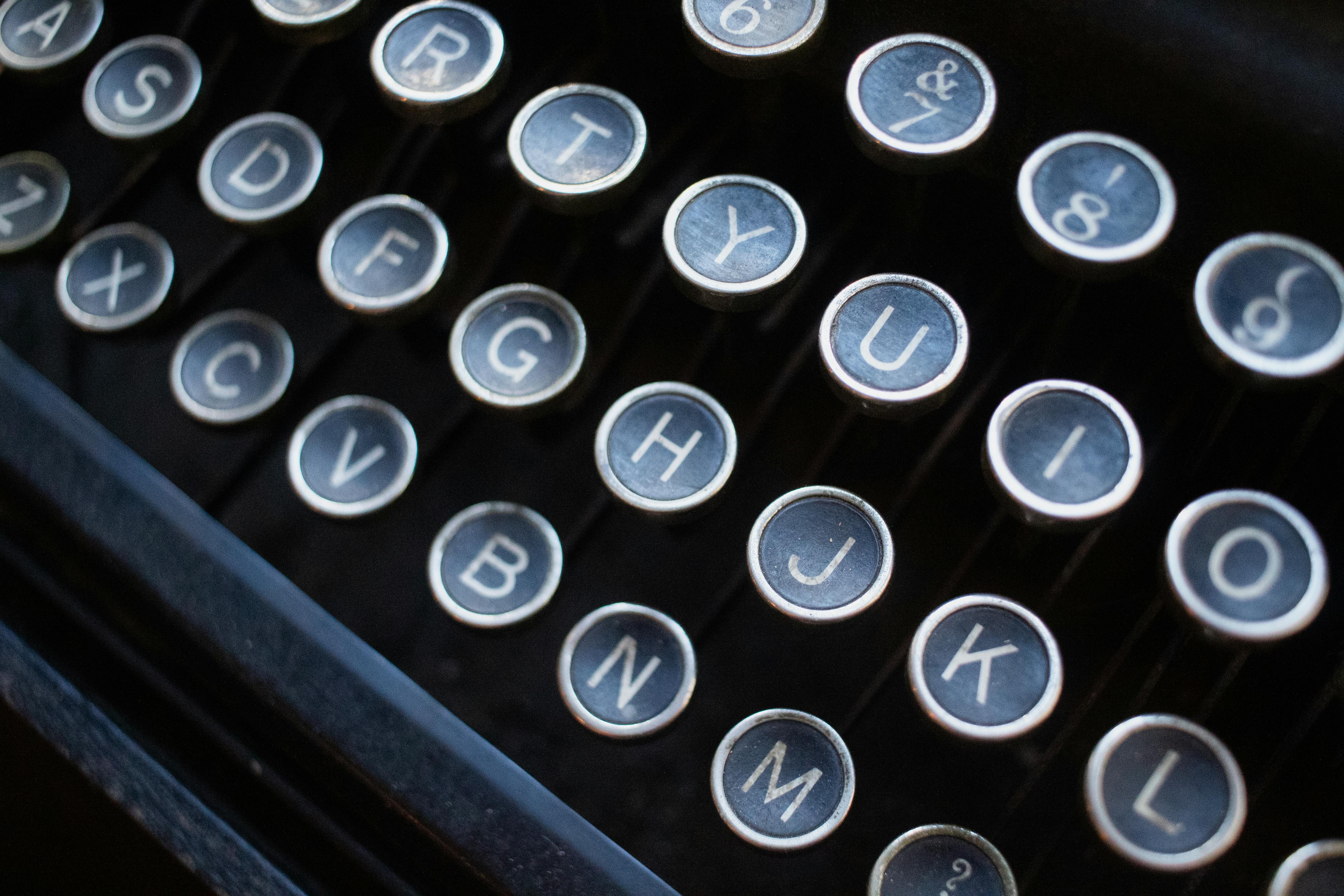 Free A close up of a typewriter with the letters on it Stock Photo
