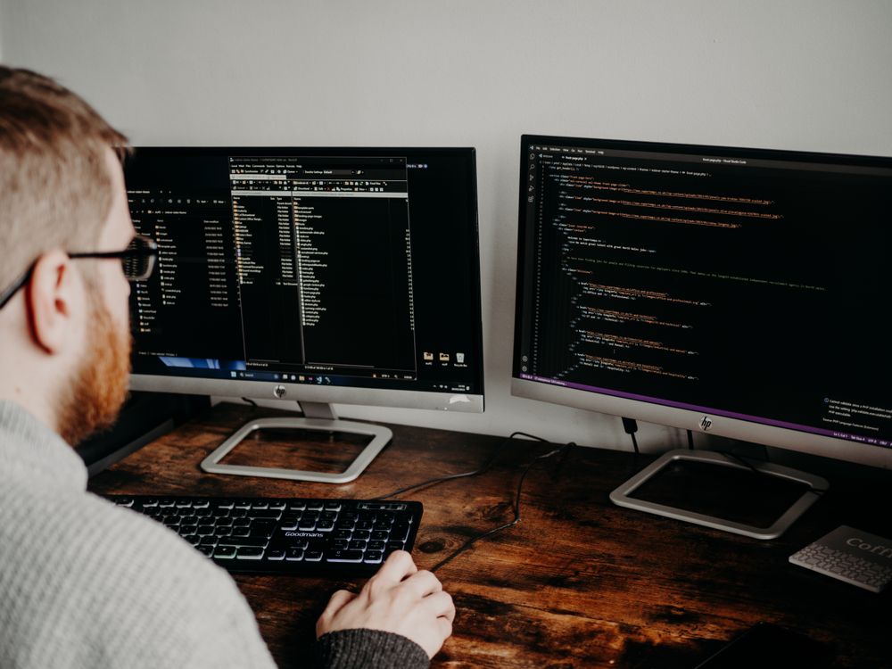 A person using a computer in an office.