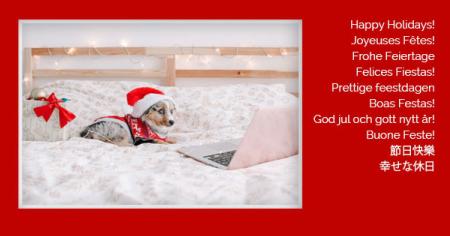 Holiday card featuring a cute dog wearing a Santa Hat, with greetings in multiple languages