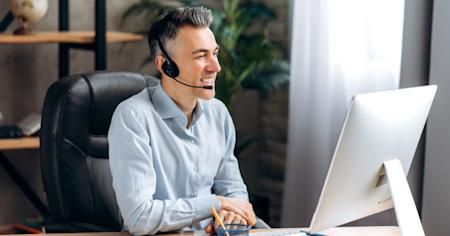 IT technician multitasking on multiple Mac and Windows computers, efficiently performing IT tasks