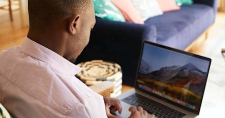 A man using a computer. Cancelling TeamViewer takes many steps