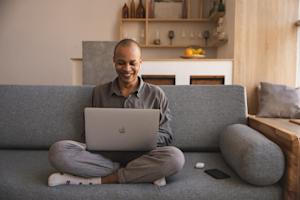 A man at home using Splashtop on his laptop to work securely from home.
