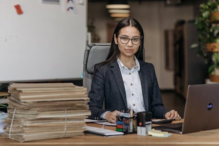 A person in an office working on a computer.