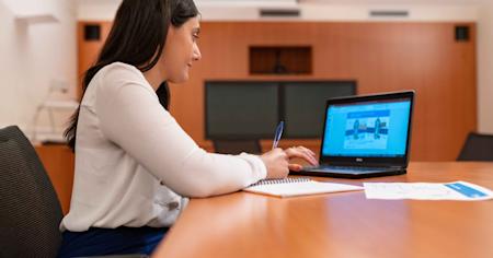 A businesswoman using her PC laptop.