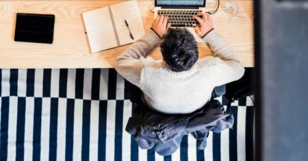 IT admin at desk using laptop for remote computer access