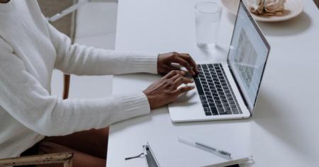 Person using a laptop and researching Splashtop Business Access, listed among top 5 remote desktop features online