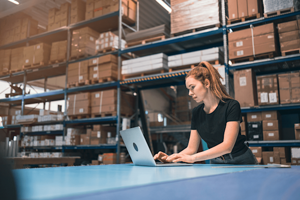 Lady using a Splashtop while in a warehouse