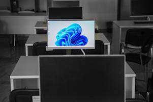 Computers on desks in an office.
