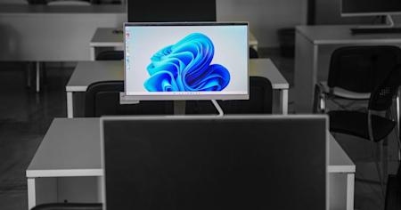 Computers on desks in an office.