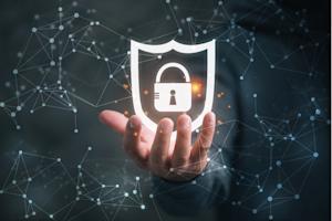 Hand holding cybersecurity lock and shield icon