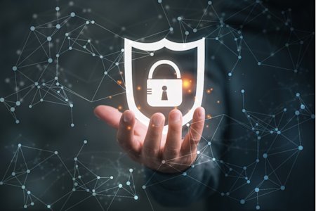 Hand holding cybersecurity lock and shield icon