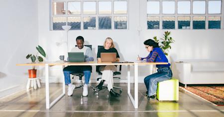 Three employees of a small business using Splashtop's remote IT support features.