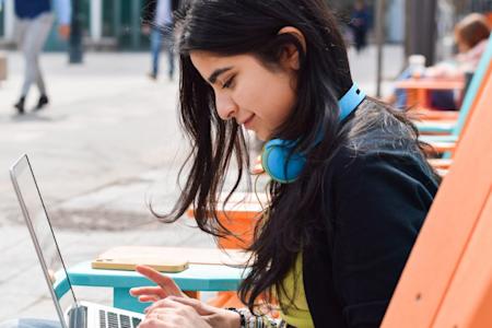 Girl outside using Splashtop to remotely access educational courses