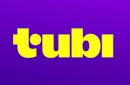 The image shows the Tubi logo with the word tubi in bold, yellow lowercase letters against a purple background.
