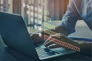 Person using a laptop computer to rate computer software