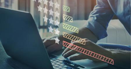 Person using a laptop computer to rate computer software