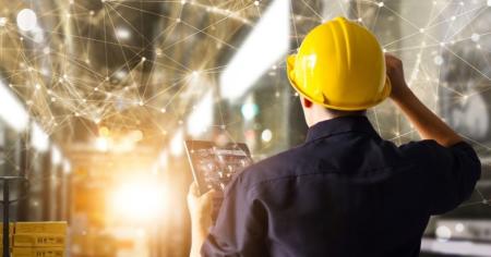 A construction worker on an IoT tablet.