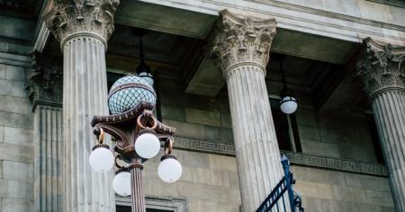 Elegant historical building and ornate street lamps