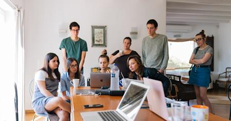 A group of students working together on their laptops