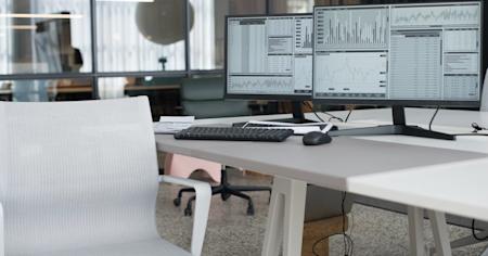 Desktop computers in an office.