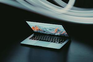 A laptop halfway open.