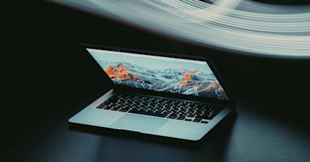 A laptop halfway open.
