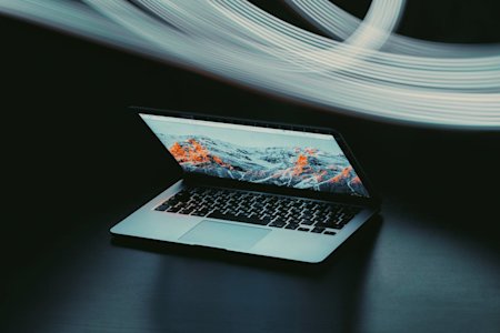 A laptop halfway open.