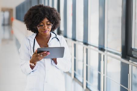 Healthcare professional reviewing data on a tablet possibly using Splashtop