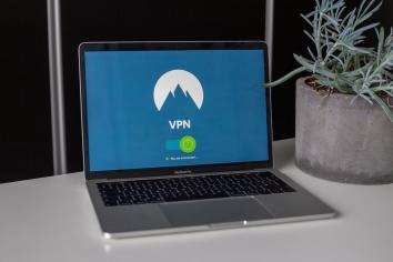 A laptop sitting on a desk displaying a VPN screen