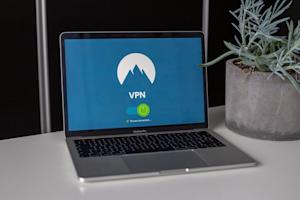 A laptop sitting on a desk displaying a VPN screen