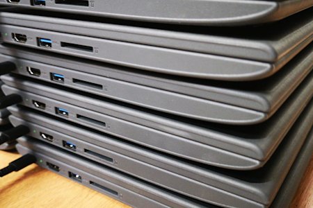 A stack of Chromebook devices.