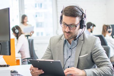 Man reading a case study titled Splashtop Remote Support Case Study with Midwest PROTECH
