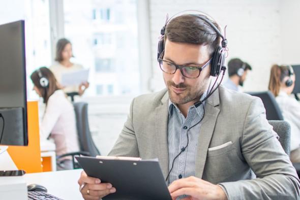 Man reading a case study titled Splashtop Remote Support Case Study with Midwest PROTECH