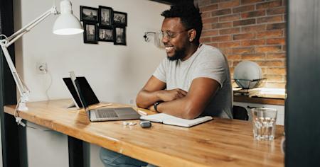 A small business owner working on his laptop.