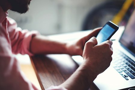 A man on an Android phone