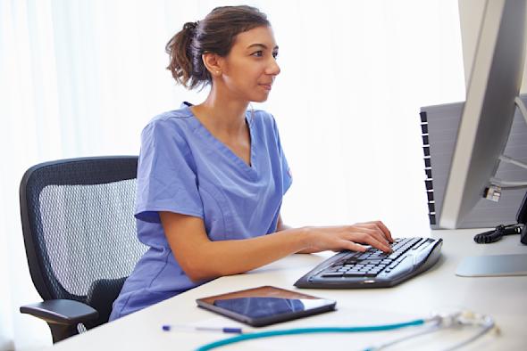 A nurse using Splashtop's remote access software to look at a patient's records.